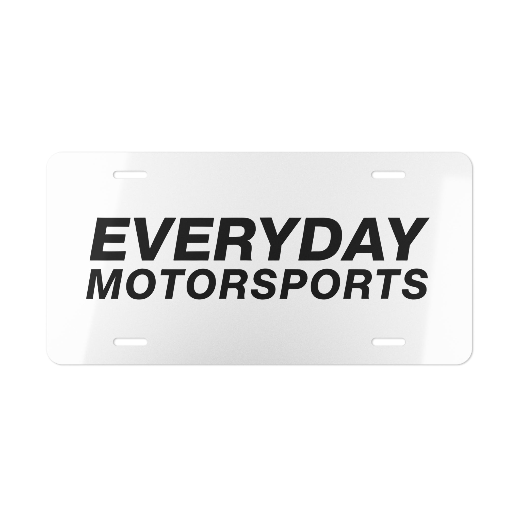 The Everyday Motorsports License Plate featuring the black Everyday Motorsports logo on a license plate.