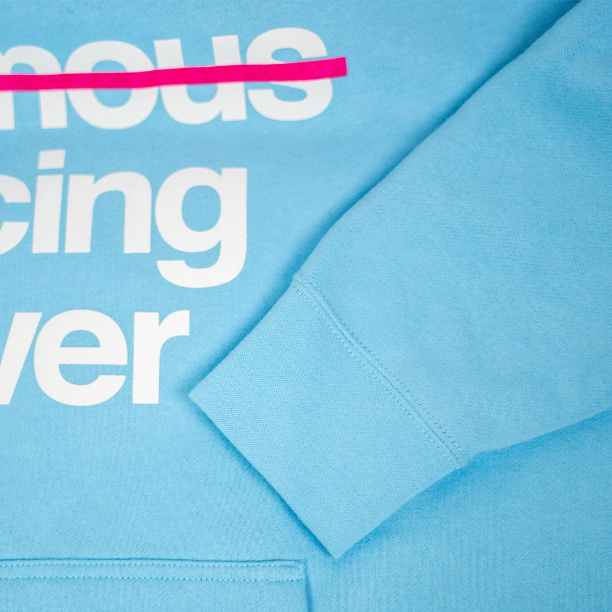 The front of the light blue Not Famous Racing Driver Hoodie from Not Famous Racing Apparel close up.