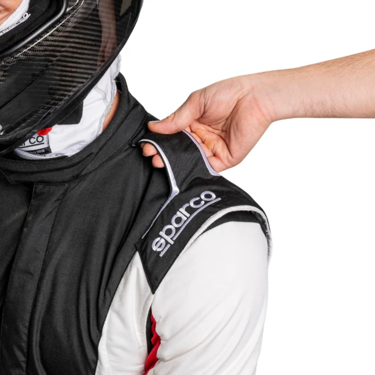 The black and white SFI 3.2a/5 rated Sparco Competition US Racing Suit up close showing the shoulder in use.