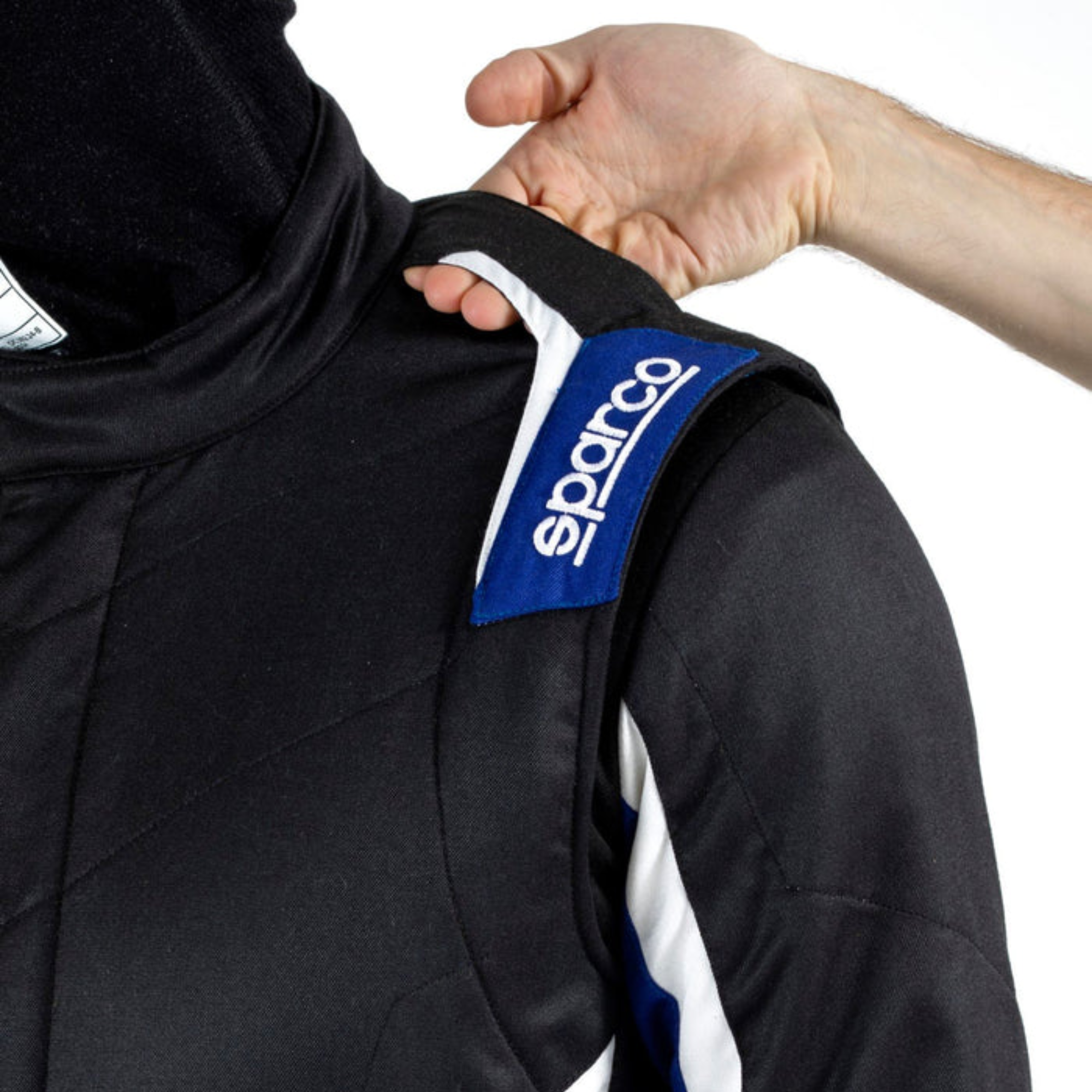 The black and blue Sparco Sprint Pro Racing Suit from Sparco shoulder strap.