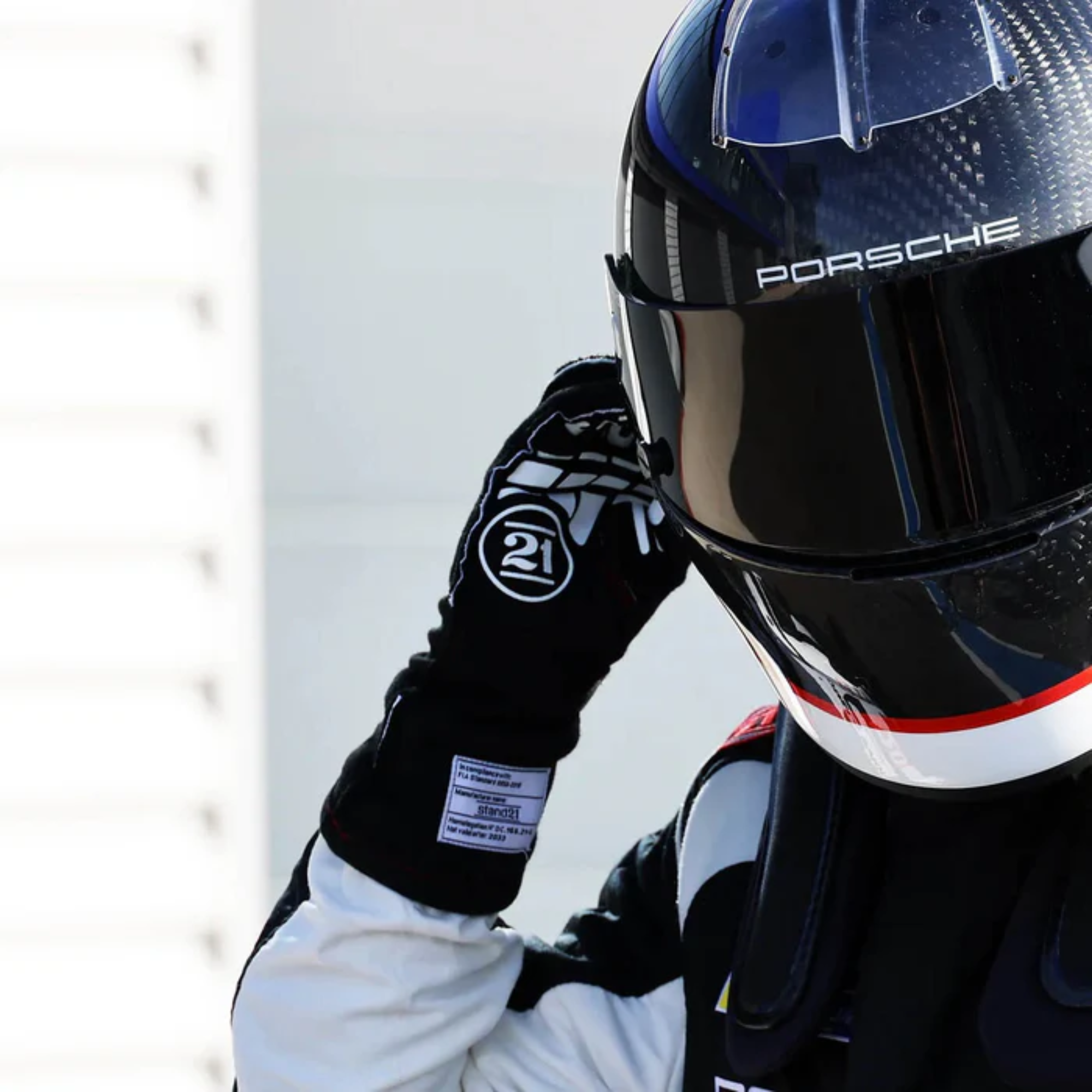 The black Stand-21 Porsche Motorsports Legacy Racing Gloves from Stand 21 trackside.