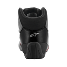 The heel of the asphalt, black and orange Alpinestars Tech 1-K Start v2 Karting Shoes.