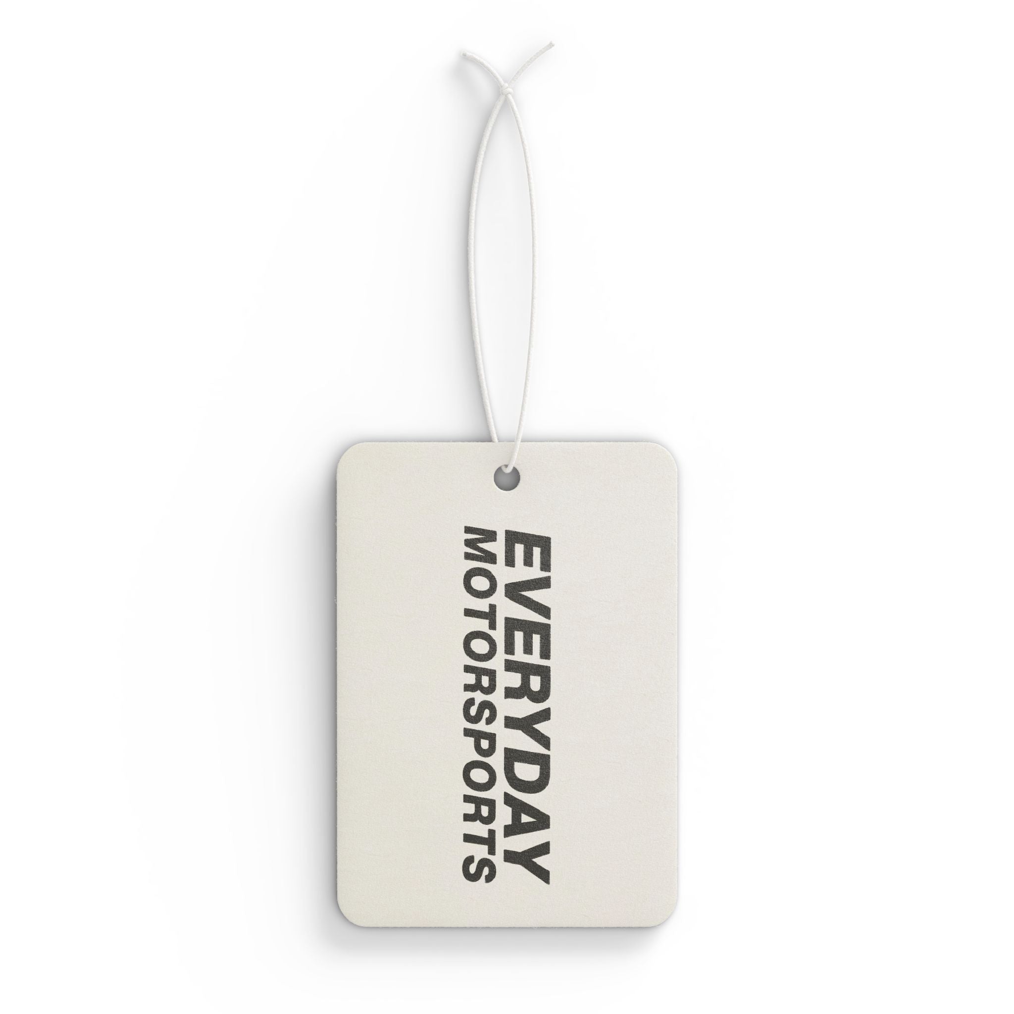 The white Everyday Motorsports Car Air Freshener which comes in three unique scents.