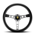 The silver Momo Prototipo Steering Wheel.