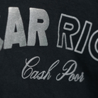 The black Car Rich Cash Poor Tee from Not Famous Racing Apparel showing the design close up.