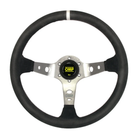 The black suede OMP Corsica Steering Wheel with silver spokes.