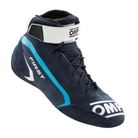 The navy and cyan OMP First v2 Racing Shoes close up.
