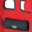 The OMP Seat Lumbar Cushion Small shown on a red racing seat.