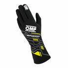 A single glove from the pair of black and yellow OMP Sport Fire-Resistant Racing Gloves.