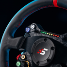 The Simagic Neo X 330R Classic Steering Wheel close up in a lifestyle photograph.