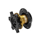 The gold Bolt-On Style Sparco Steering Wheel Quick Release.
