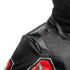 The black and red Sparco Superleggera K Youth Kart Racing Suit from Sparco focusing on the shoulder.