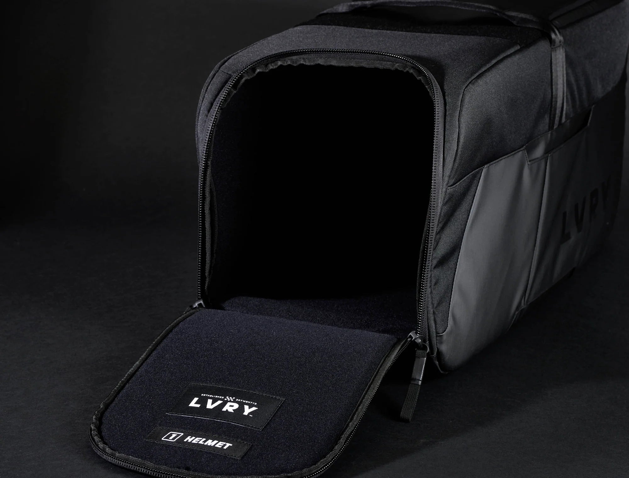 The LVRY CRRY Gear Bag from LVRY empty, showing the helmet storage compartment.