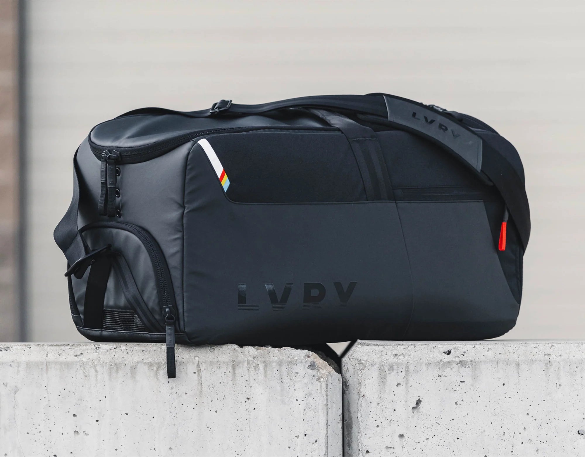 The LVRY CRRY Gear Bag from LVRY outdoors in a lifestyle photograph.