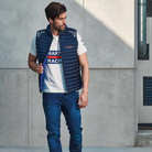 The navy blue Sparco Martini Gilet Vest Jacket from Sparco being worn outdoors in a lifestyle photograph.