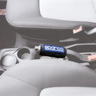 The black Sparco Mini Harness Belt Pad from Sparco on a parking brake within a car. all-groups