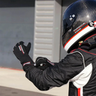 The black Stand-21 Porsche Motorsports Legacy Racing Gloves from Stand 21 used at a track day.
